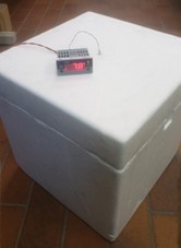 polysterene box and thermometer inserted inside of it